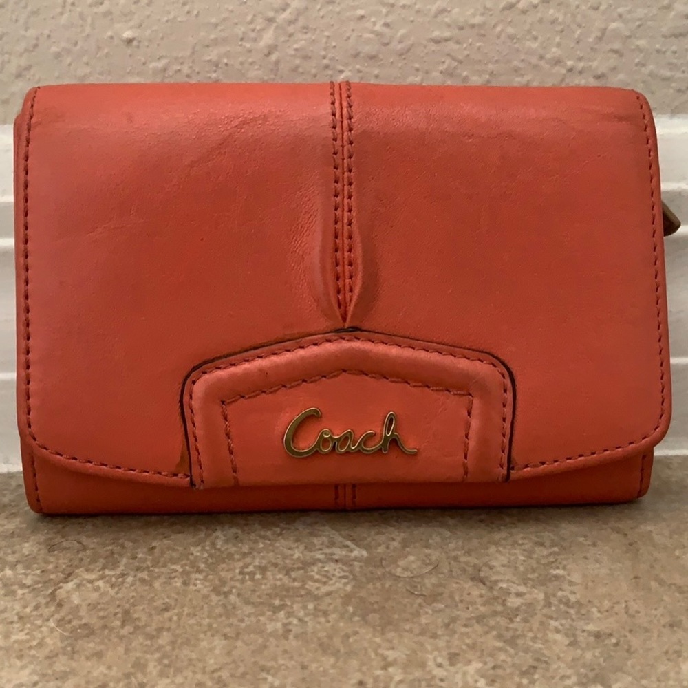 Coral Coach leather wallet with tan interior